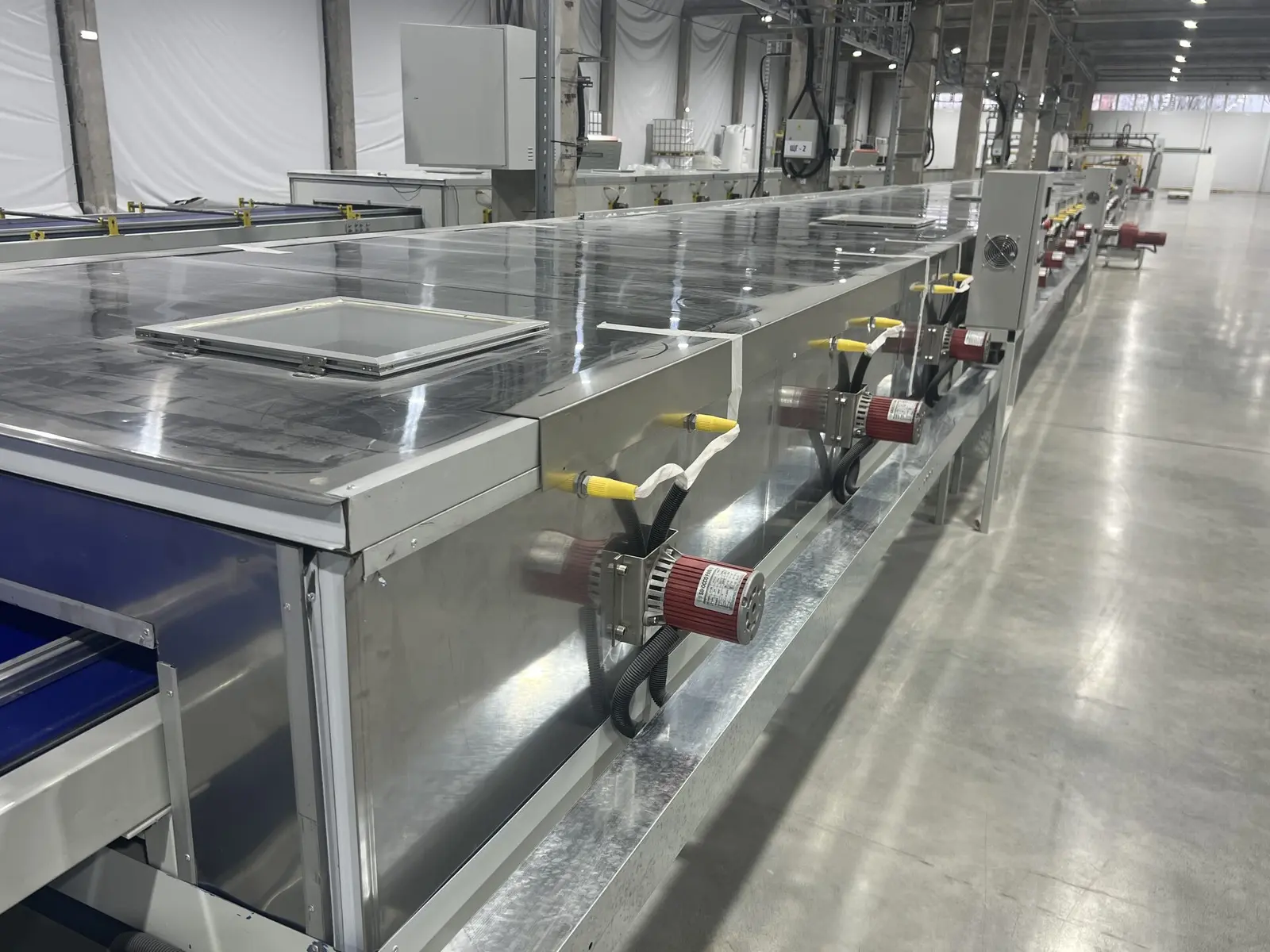 Curing tunnel on the LISTACRYL sheet line — the enclosed section where acrylic solid surface sets